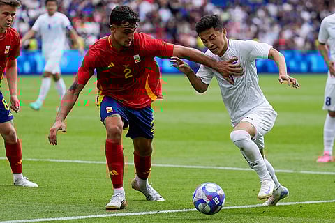 Marc Pubill and Abbosbek Fayzullaev battle for the ball